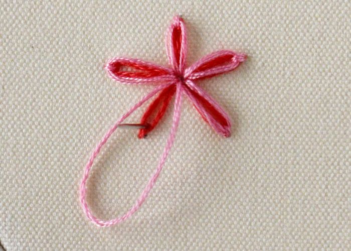 Second flower in pink for double lazy daisy stitch