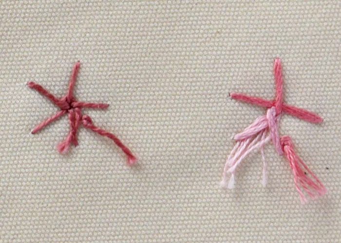 Fiori a punto ruota intrecciato in cotone perlato rosa e filati variegati, lato posteriore