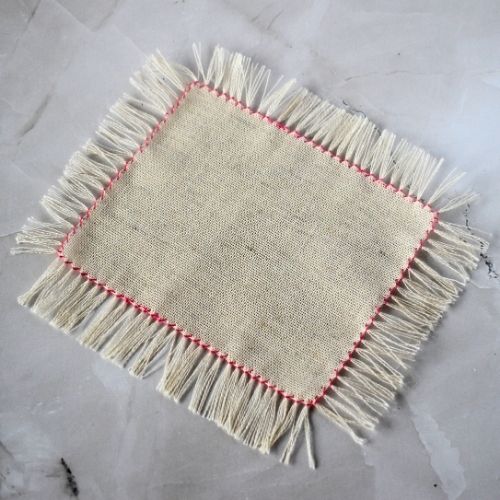 Punto a giorno con orlo a frangia